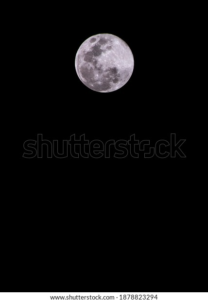 close up moon over black\
sky