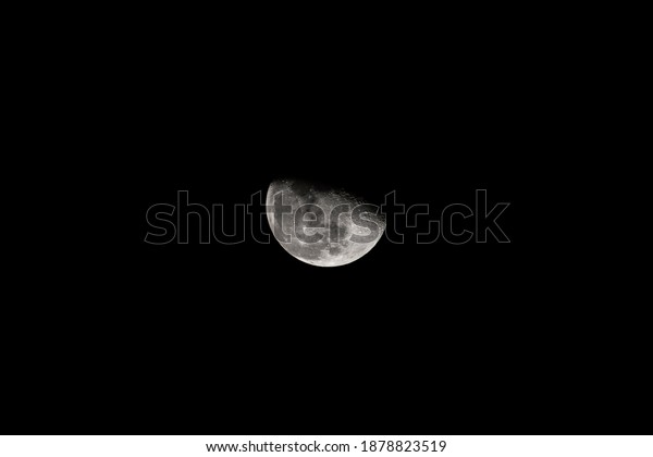 close up moon over black\
sky