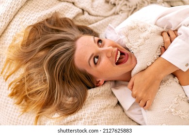 Close Up Moring Portrait Of Pretty Blonde Woman Laying On The Bed, Exited Face, Perfect Relaxing Time Alone.