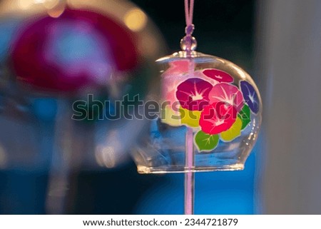 close up of morning glory pattern on windchimes