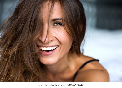 Close up morning portrait of smiling pretty woman with green eyes, sensual fresh happy face, positive emotions.
