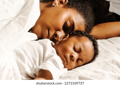 Close up mother sleeping with baby. - Powered by Shutterstock