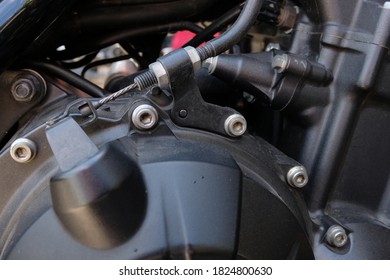 A Close Up Of A Motorcycle Clutch Cable On The Engine