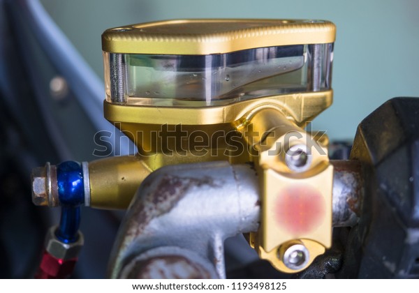 close up of motorcycle container brake fluid,\
brake master cylinder\
reservoir