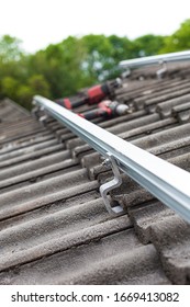 Close Up Of Mounting Rail For Photovoltaic System On Roof Building Site