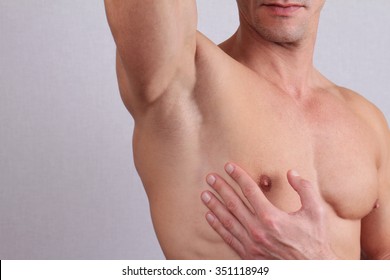 Close Up Of Muscular Male Torso, Chest And Armpit Hair Removal. Male Waxing