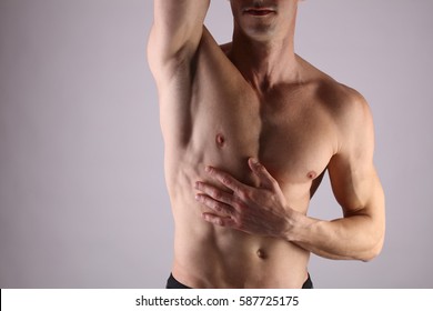 Close Up Of Muscular Male Torso, Chest And Armpit Hair Removal. Male Waxing