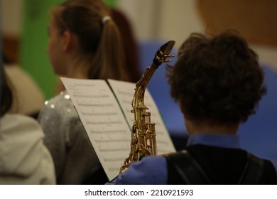 Close Up Of A Musical Instrument Saxophone In A Child Playing In A Lesson In A School Orchestra.Background Image Of Creative Learning And Development Of Children