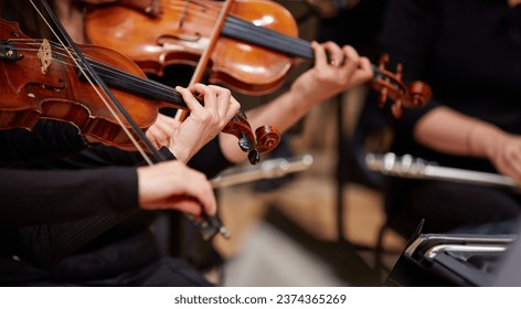 Close up of musician hands playing violin - Powered by Shutterstock