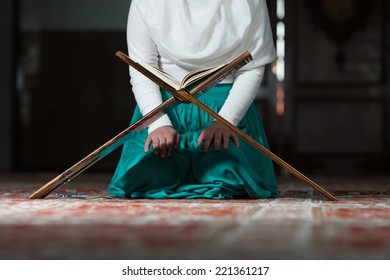 Close Up Muslim Woman Reading Holy Islamic Book Koran - Powered by Shutterstock