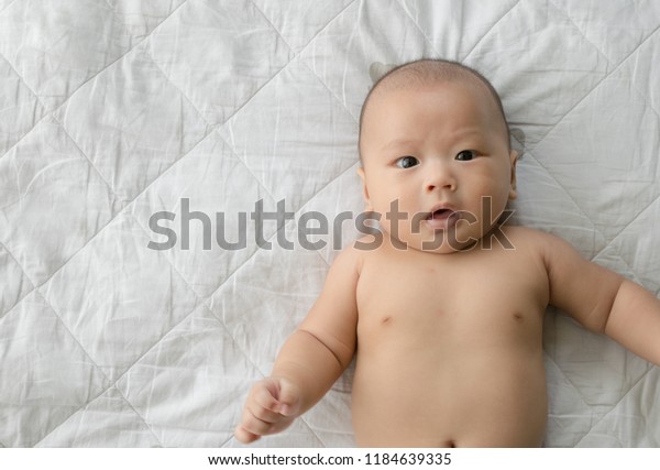 Asian Looking Down Nude - Close Naked Asian Baby Looks Surprise Stock Photo (Edit Now ...