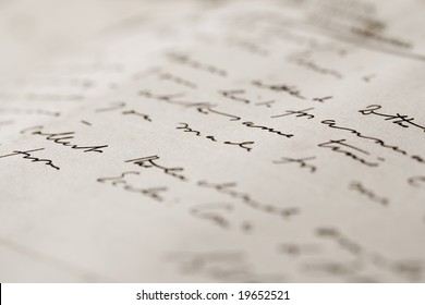 A close up with a narrow depth of field of a hand-written letter