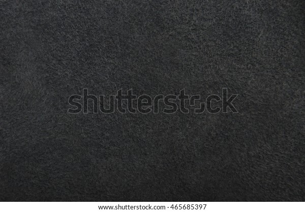 Close up of\
natural black suede leather\
background