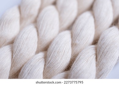 Close up of natural cotton rope. Thick cotton rope showing detail of threads and fibres, macro shot
