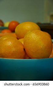 Close Up Navel Oranges In Blue Plastic Bowl