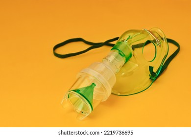 Close Up Of Nebulizer Device Of Health. Nebulizer Color Is Green And White. Nebulizer Mask On Isolated Background