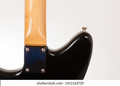 Close Up Of Neck Plate On Black Electric Guitar With Bolt On Neck , Rear View, Studio Shoot.  Alder Body, Maple Neck. 