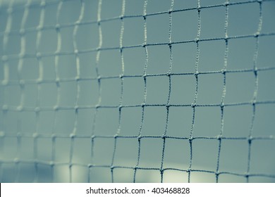 Close up of net in badminton court for sport background fade vintage filter
