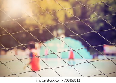 Close up net on the back of outdoor fut sal stadium. Selective focus. Vintage tone. Flare