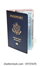 Close Up Of New American Passport Standing Upright Slightly Open Showing 