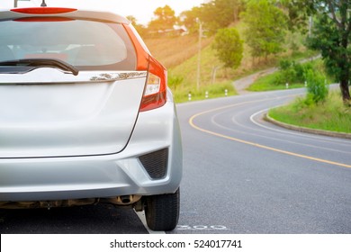 Close up of new silver hatchback car parking on local road - Shutterstock ID 524017741