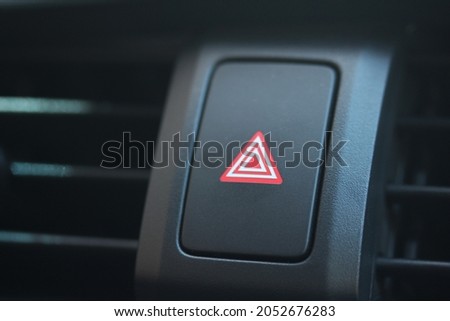 Close up of a new vehicle hazard warning light switch 