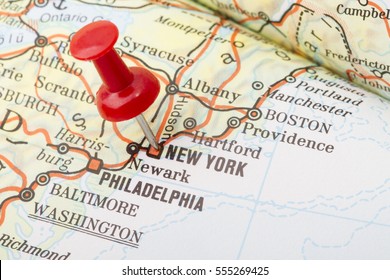 Close up of New York USA map with red push pin.