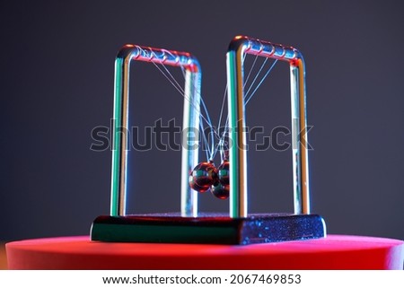 close up newton pendulum tangled