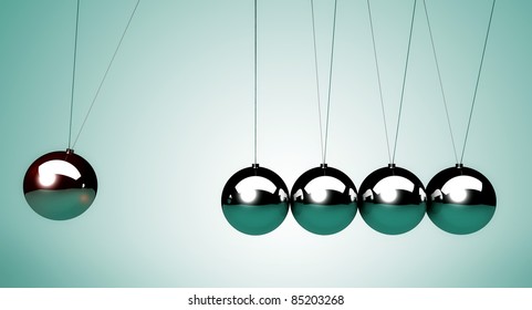 close up of the Newton's cradle, particularly of the spheres