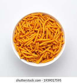 Close Up Of Nimbu Masala Besan Sev Indian Namkeen (snacks) On A Ceramic White Bowl. Top View