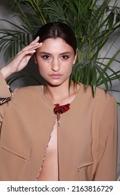 Close Up Non Retouched Image Of Brunette Model With A Big Mole On Her Face, Professional Make Up And Up-do Hairstyle. Unconventional Beauty Body Positivism. Brown Blazer Decorated With Pin Brooch