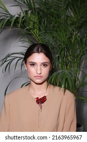 Close Up Non Retouched Image Of Brunette Model With A Big Mole On Her Face, Professional Make Up And Up-do Hairstyle. Unconventional Beauty Body Positivism. Brown Blazer Decorated With Pin Brooch