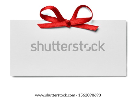 close up of a note card with ribbon bow on white background