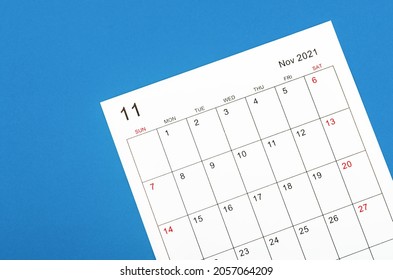 Close Up November 2021 Calendar Sheet On Blue Background.