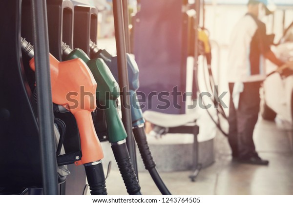 close up
nozzle fuel for fill oil into car or motorcycle tank at pump gas
station, transport energy, transportation power business technology
concept, travel and lifestyle, vintage
tone