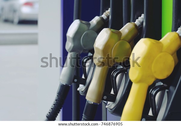 close up nozzle fuel in gas station, transport\
and business concept