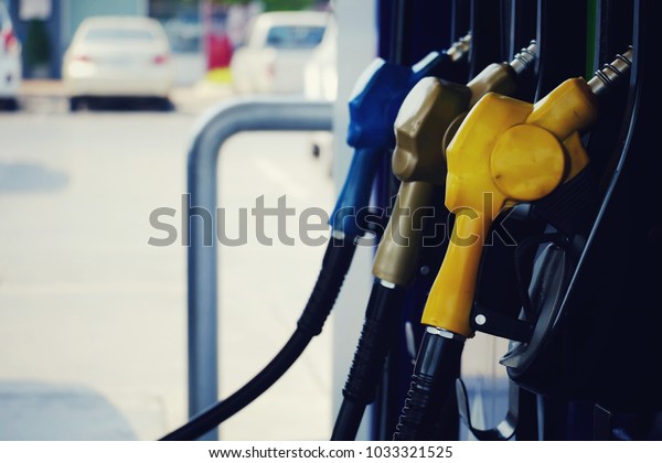 close up nozzle fuel in pump gas station, saving\
money and energy for transport, transporation technology and manage\
for success business\
concept