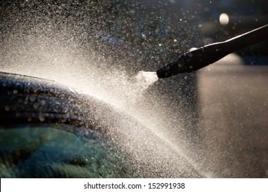 Close Up Of Nozzle Of High Pressure Washer Used On Car