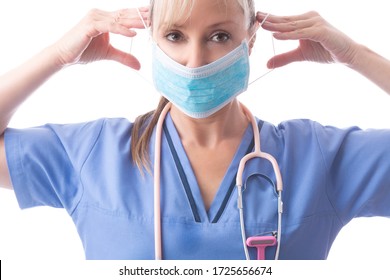 Close up of a nurse or doctor putting on a medical surgical ear loop face mask one of the critical PPE required. - Powered by Shutterstock