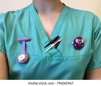 Close Up Of A Nurse In Scrubs.