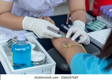 Close up Nurse taking blood sample for test.