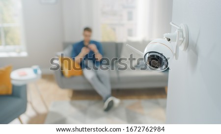 Similar – Image, Stock Photo Two surveillance cameras on the corner of a house