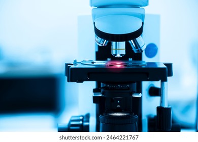 Close up objective lens microscope in laboratory.Examining histological sample, a biopsy in the laboratory of cancer research.Medical patholology and cytology laboratory concept.