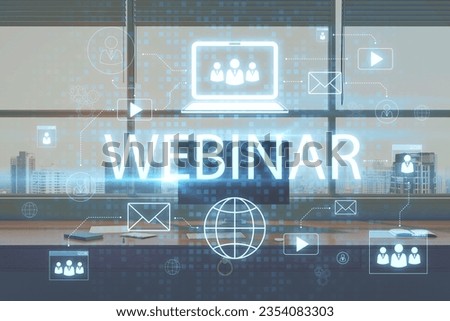 Close up of office workplace with computer and creative webinar hologram on blurry background. Online meeting and seminar concept. Double exposure