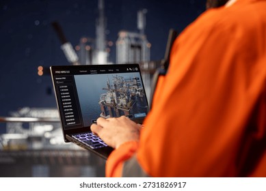 Close up of offshore platform technicians checking equipment status indicators on laptop system dashboard. Workers verifying hydraulic pressure levels on notebook digital monitoring panel