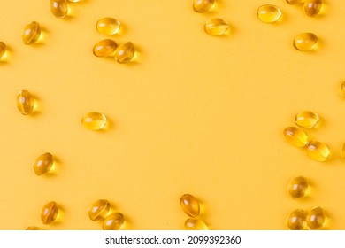 Close up of  oil filled capsules suitable for: fish oil, omega 3, omega 6, omega 9,  vitamin A, vitamin D, vitamin D3, vitamin E  - Shutterstock ID 2099392360