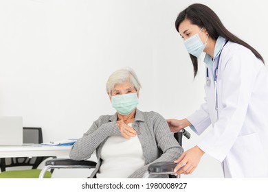 Close Up Old Asian Patient, Female Doctor Diagnosis And Treatment Old Patient, Patient Cough And Feeling Chest Pain, She Sitting On Wheelchair, They Wear Surgical Mask, Respiratory Disease Protection