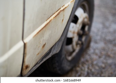Close up old auto with rust. Wheel and copy space. Powerty concept