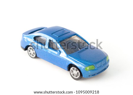 Close up old blue car toy isolated on white background. (Selective focus)
