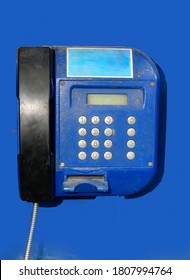 The Close Up Of An Old Blue Vintage Payphone At The Blue Isolated Background